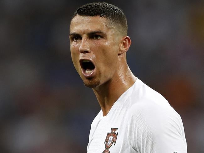 FILE - In this file photo dated Saturday, June 30, 2018, Portugal's Cristiano Ronaldo reacts during the round of 16 match between Uruguay and Portugal during the 2018 soccer World Cup at the Fisht Stadium in Sochi, Russia. Cristiano Ronaldo is leaving Real Madrid it is announced Tuesday July 10, 2018, to join Italian club Juventus, bringing to an end a hugely successful nine-year spell in Spain. (AP Photo/Francisco Seco, FILE)