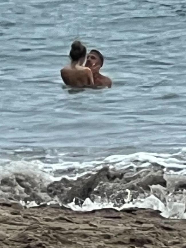 Mauricio and Nikita cuddle up in the ocean. Picture: BACKGRID