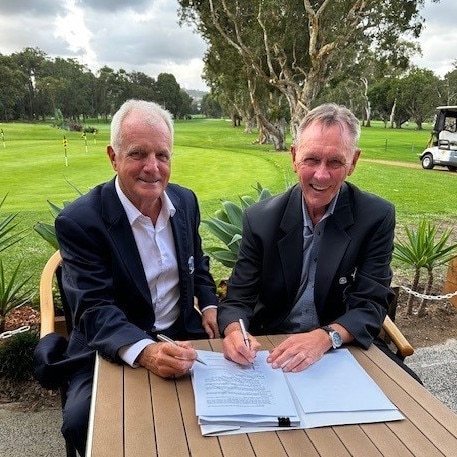 Warringah Golf Club vice president, Graeme McMullan (left) and club president, Scott Campbell, sign the contract for the construction of the new clubhouse to be built at North Manly, with work due to start in July 2025. Picture: Supplied