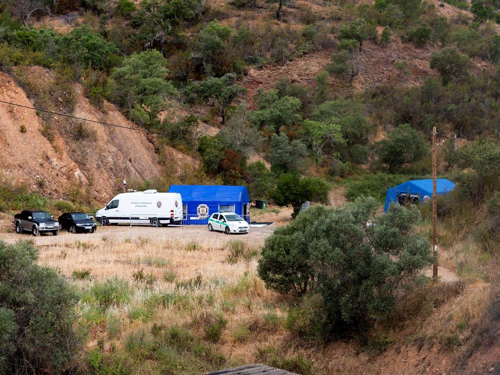 Police vehicles and tents at the site of the remote reservoir. Picture: Reuters