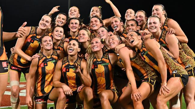 CAIRNS, AUSTRALIA - OCTOBER 24: The Hawks pose for a selfie after winning the round nine AFLW match between Hawthorn Hawks and Narrm (Melbourne Demons) at Cazaly's Stadium, on October 24, 2024, in Cairns, Australia. (Photo by Emily Barker/Getty Images)