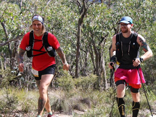 Mat Grills (left) competes in the gruelling Down Under 135.