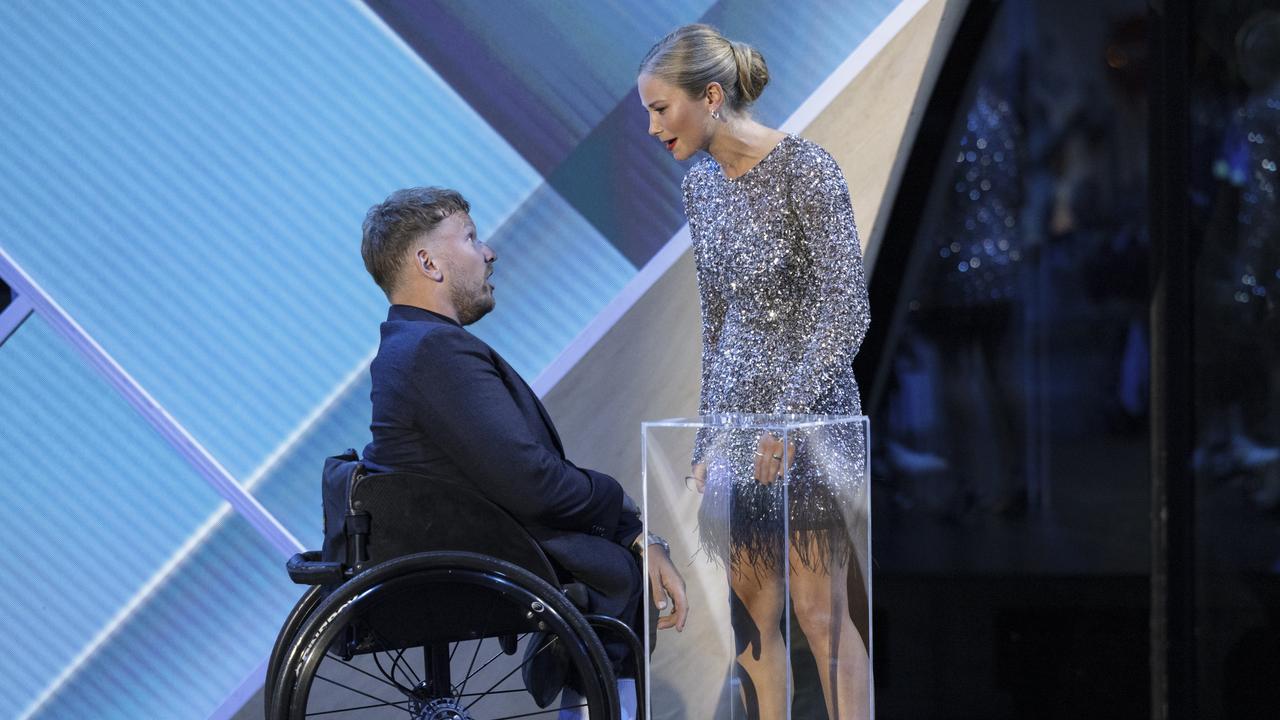 Australian of the year Dylan Alcott greets Grace Tame at the 2022 Australian of the Year Awards. Picture: Brook Mitchell/Getty Images