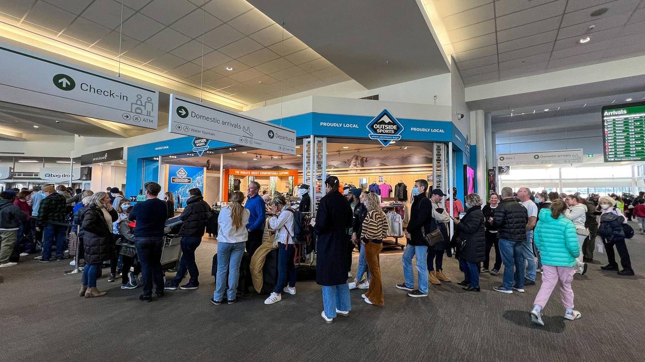 People queue at Queenstown airport to try and rebook seats after flights were cancelled. Picture: James Allan/NZ Herald