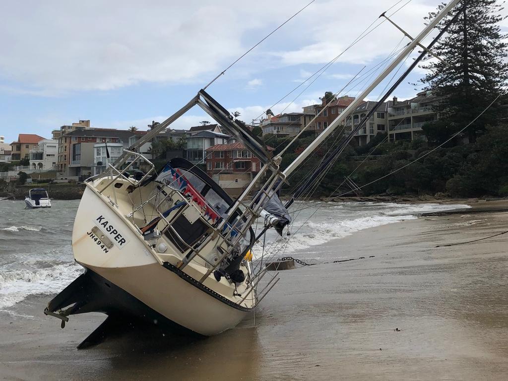 One of the yachts that washed onto Little Manly. Picture: Jim O'Rourke.