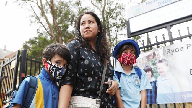 Mum Fabia Ricardo made masks for her kids Zane and Alex. Picture: John Grainger