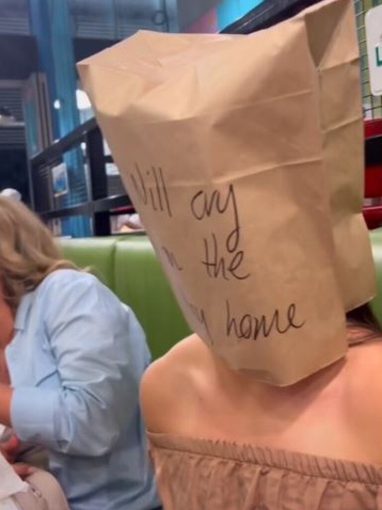 They put a paper bag over one of the customer's head. Picture: TikTok / Bec Hardgrave