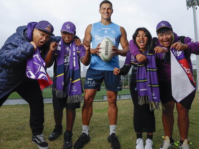 Melbourne Storm winger Will Warbrick with the Vaeau family, who are all Storm members, ahead of his 50th game against Parramatta on Sunday March 9 at AAMI Park. Picture: Michael Klein