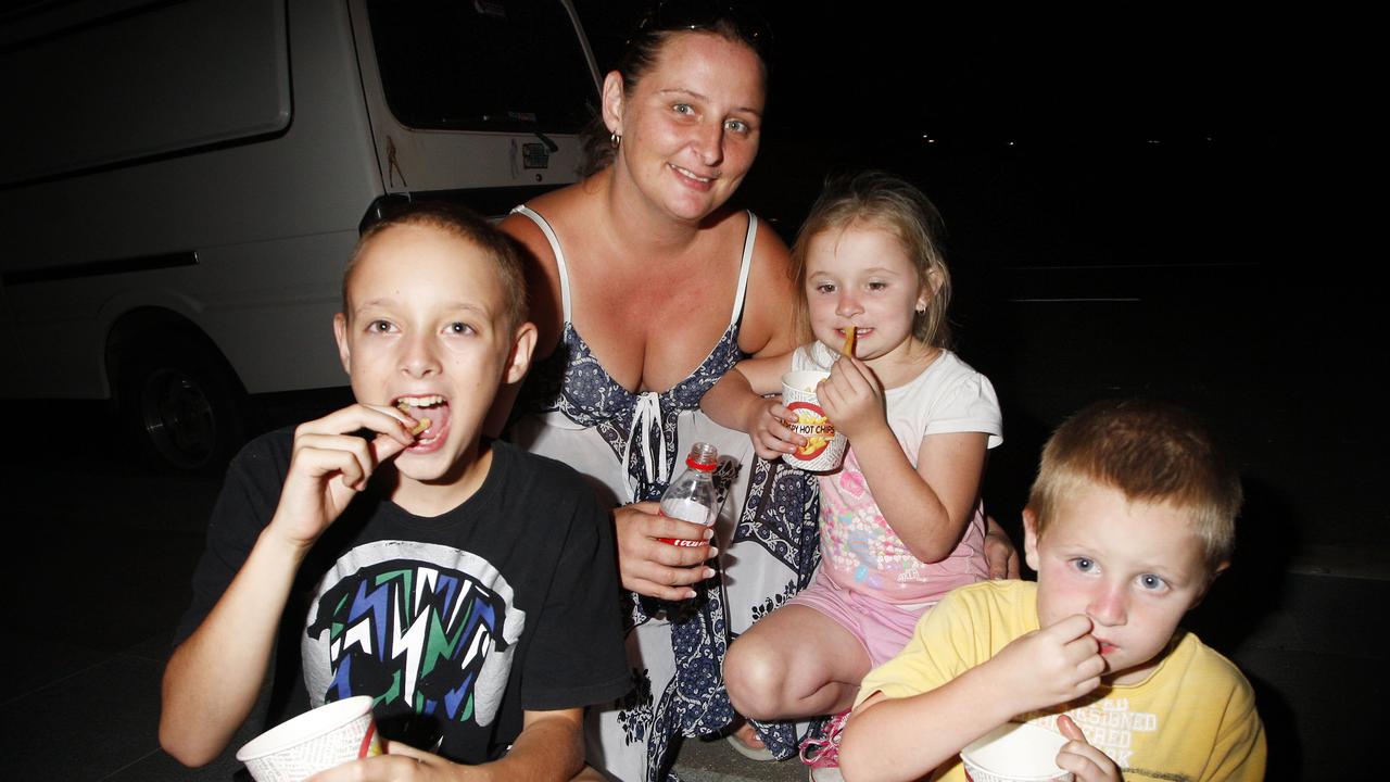 2010: New Year’s Eve celebrations at Timothy Moloney Park. Tanya McPhail of Redbank Plains with her children. Photo: David Nielsen