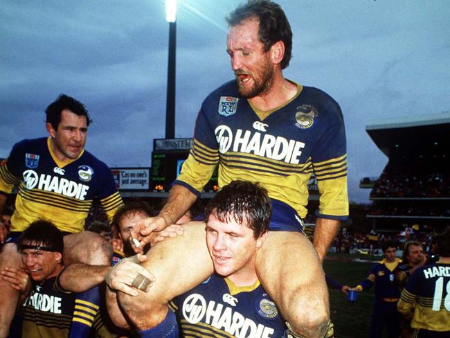 Ray Price and Mick Cronin are chaired from the ground following Parramatta's grand final victory over Canterbury-Bankstown in 1986. Pic: Colin Whelan Action Photographics