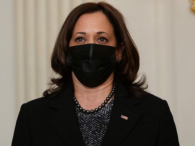 US Vice President Kamala Harris listens to US President Joe Biden speak on tackling climate change, creating jobs, and restoring scientific integrity in the State Dining Room of the White House in Washington, DC on January 27, 2021. (Photo by MANDEL NGAN / AFP)