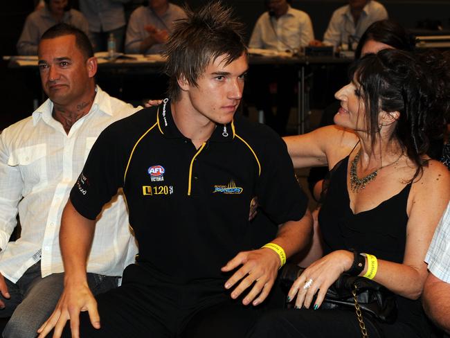 Dustin Martin with his dad Shane and mum Kathy Knight after his name was called out in the 2009 AFL National Draft. Picture: Michael Dodge