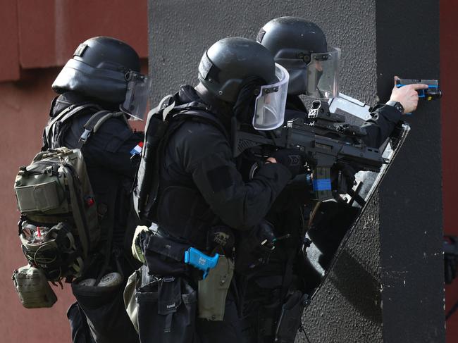 Members of French National Police elite unit RAID (Research, Assistance, Intervention, Deterrence) take part in an exercise drill simulating a mass murder, at a police academy in the Paris suburb of Draveil. Picture: AFP