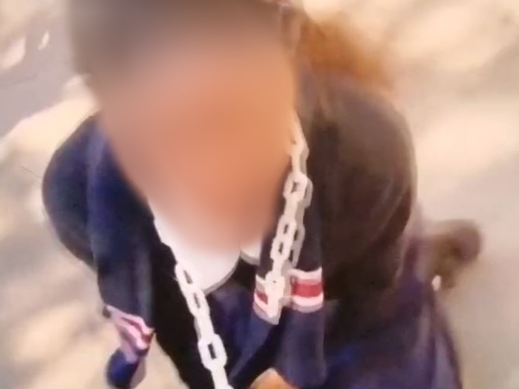 A female student is filmed being dragged around the playground with a ‘leash’ around her neck.