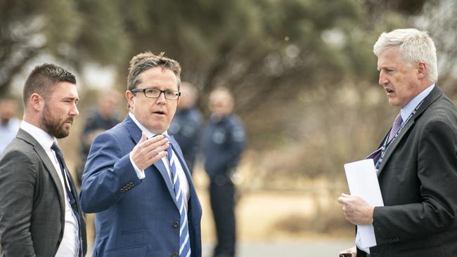 Justice Sam Doyle, middle, presiding over a jury visit in the cold case murder trial of Paul Maroroa.