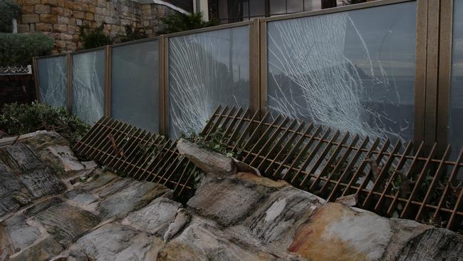 Aftermath of the severe storm on Northern Beaches. Fence of a house is totally smashed on Fairy Bower