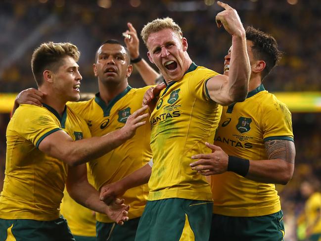 PERTH, AUSTRALIA - AUGUST 10: Reece Hodge of Australia (C) celebrates his try during the 2019 Rugby Championship Test Match between the Australian Wallabies and the New Zealand All Blacks at Optus Stadium on August 10, 2019 in Perth, Australia. (Photo by Cameron Spencer/Getty Images)