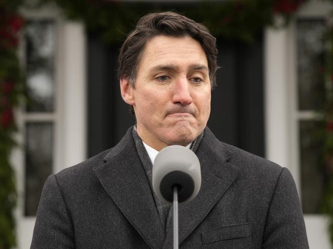 Canada Prime Minister Justin Trudeau makes an announcement outside Rideau Cottage in Ottawa on Monday, Jan. 6, 2025. (Adrian Wyld/The Canadian Press via AP)