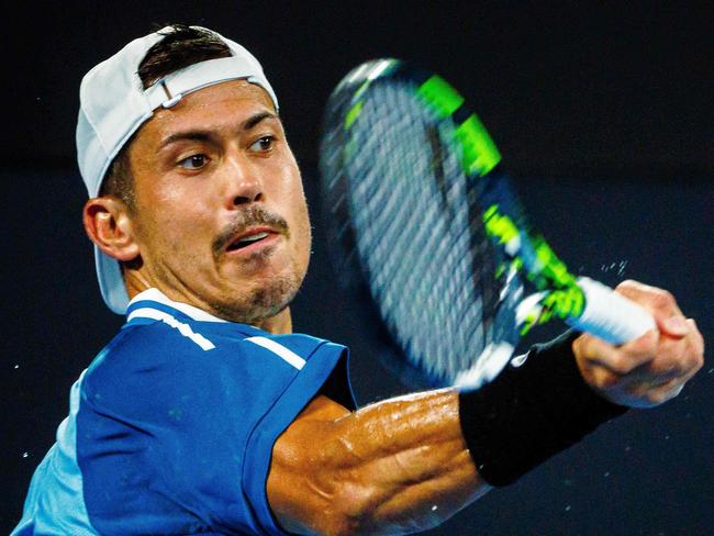 Jason Kubler of Australia hits a return during his men's singles match against Spain's Rafael Nadal at the Brisbane International tennis tournament in Brisbane on January 4, 2024. (Photo by Patrick HAMILTON / AFP) / --IMAGE RESTRICTED TO EDITORIAL USE - STRICTLY NO COMMERCIAL USE--