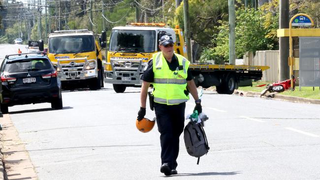 A police officer at the scene of the crash that claimed Michael Warburton’s life. Picture: Steve Pohlner