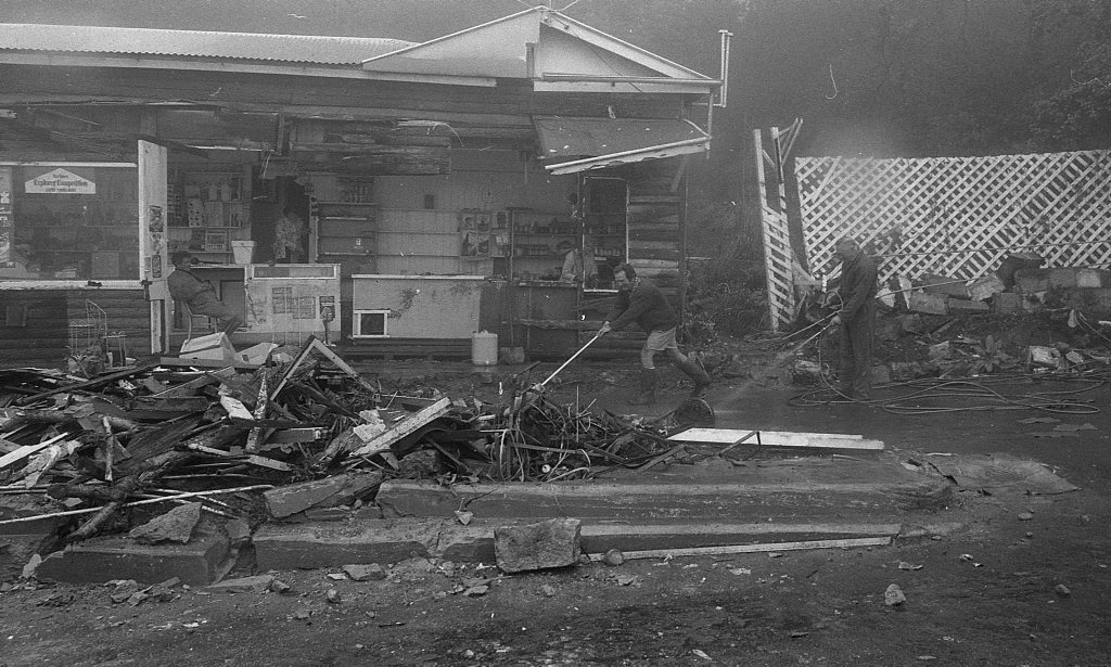 Historic: Toowoomba: Accidents: Clean up at the Log Cabin Service Station the morning after a semi-trailer rolled and crashed in the building removing most of the front of the station. The owner in 1978, Mr Neville Hammond started rebuilding immediately. Photo: Bruce Mackenzie / The Chronicle Neg: U875. Picture: Bruce Mackenzie