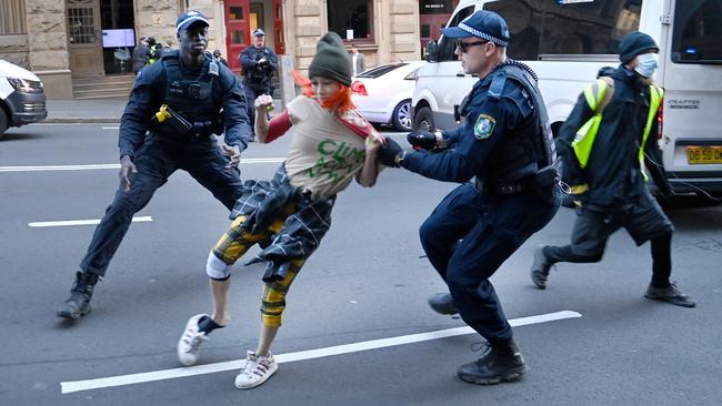 Police try to prevent climate protesters from disrupting traffic in Sydney’s CBD. Picture: NCA NewsWire/Jeremy Piper