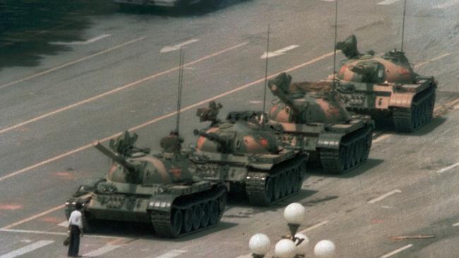 A Chinese man stands alone to block a line of tanks heading into Tiananmen Square on June 4, 1989.