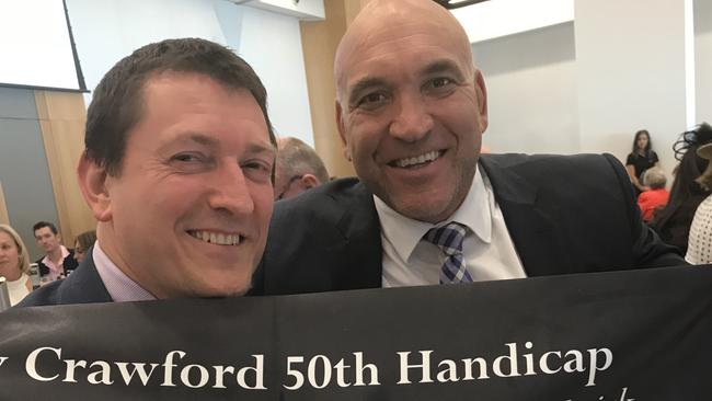 Tony Crawford and Hall of Fame inductee Gorden Tallis.