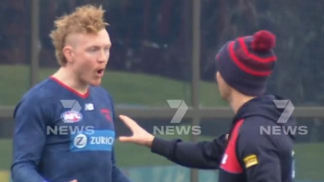 Clayton Oliver is seen arguing with a trainer at training.