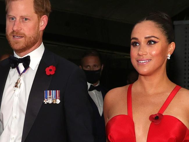 Meghan stuns in plunging red gown