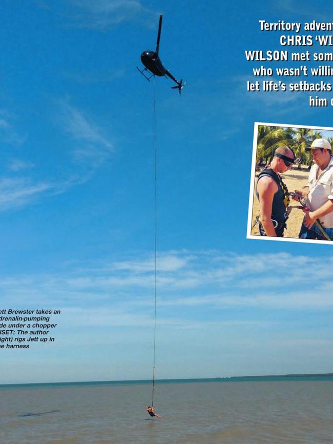 Matt Wright slinging cancer victim Jett Brewster beneath his chopper VH-MEB in June 2013. Photo: North Australian Fishing and Outdoors magazine.