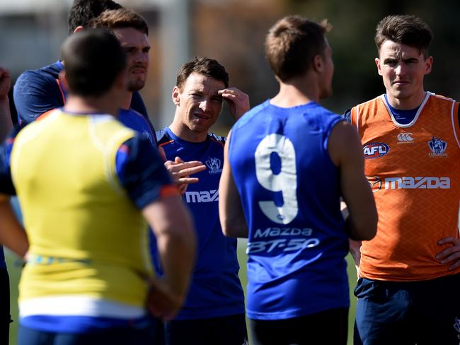Brent Harvey (centre) during training. Picture: Tracey Nearmy/AAP