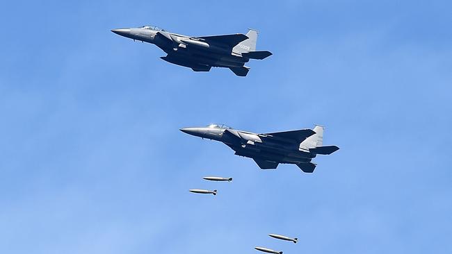 South Korea's F-15K fighter jets drop bombs during training at the Taebaek Pilsung Firing Range in response to North Korea’s missile test. Picture: Getty