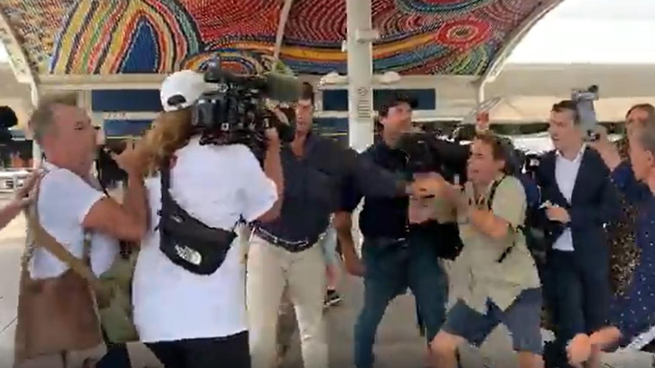 The group got into a waiting car after powering through the group of media who had gathered. Picture: Sky News