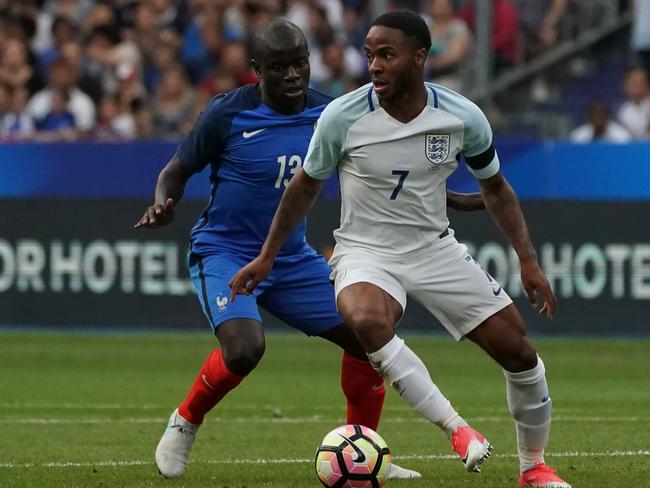 England's midfielder Raheem Sterling (R) controls the ball as France's defender N'golo Kante looks on during the international friendly football match between France and England at The Stade de France Stadium in Saint-Denis near Paris on June 13, 2017.                 / AFP PHOTO / Thomas SAMSON