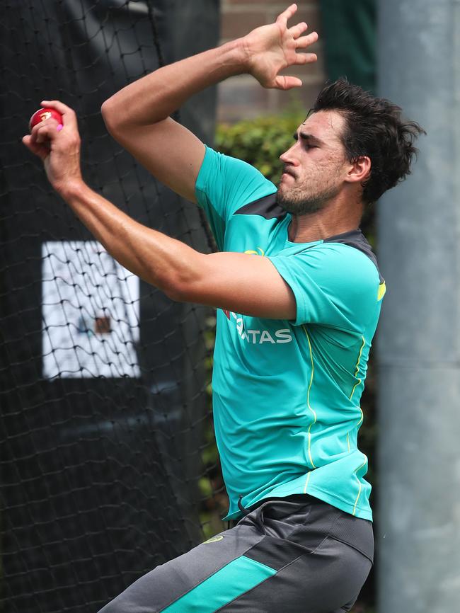 Mitchell Starc steams in during Australian team training at the SCG today. Picture: Phil Hillyard