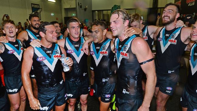 Port sing the song and drown new players Steven Motlop, Tom Rockliff, Dom Barry and Jack Watts of Port Adelaide after beating Fremantle. Picture: Mark Brake/Getty Images