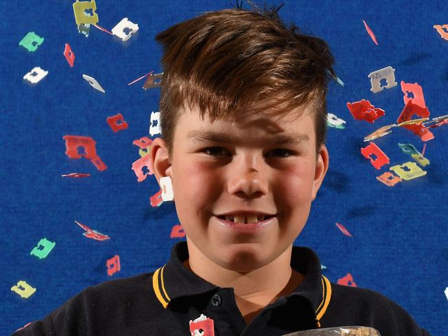 Port Noarlunga Primary school student Jake Hansen - 8yrs poses for a photograph at school in Port Noarlunga, Adelaide on Thursday the 19th of September 2019. Jake has been collecting bread tags for "Bread Tags for Wheelchairs" for the production of wheelchairs and is trying to get the whole community involved.  (AAP Image/Keryn Stevens)