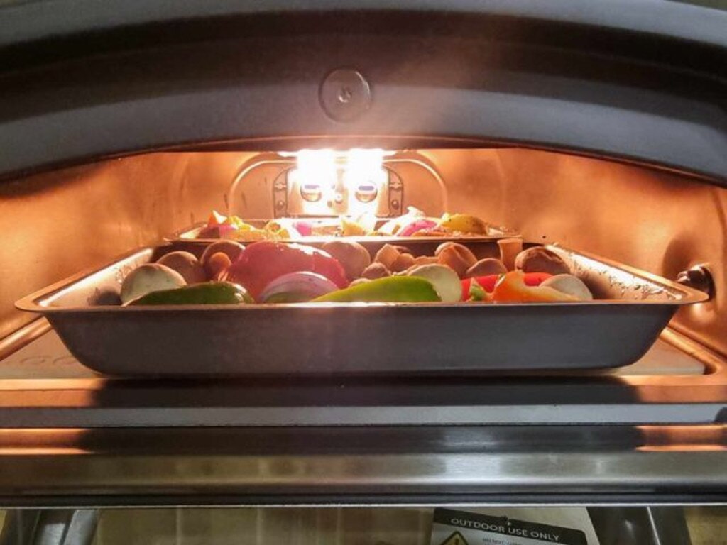 Inside the Karu 12G pizza oven on low to medium heat. Picture: Tahnee-Jae Lopez-Vito/news.com.au.