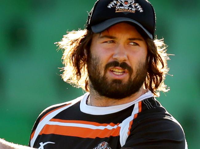 Aaron Woods points the way during Wests Tigers training at Concord Oval .Picture Gregg Porteous