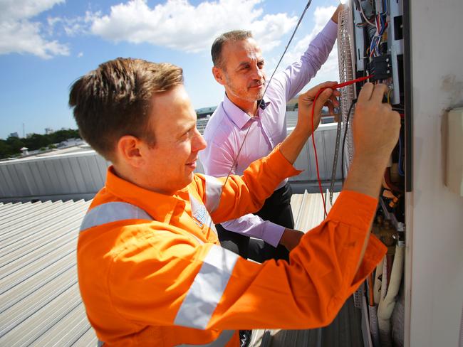 Trilogy Building Services general manager George Fountis, whose Auburn business has taken on apprentices in recent years. He is pictured with worker Anthony Jans.