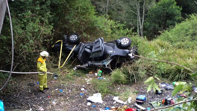 The Toyota Hilux was shunted off a bridge on the M1 at Morisset, trapping the driver. Photo: Westpac Rescue Helicopter