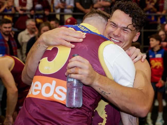 Former Brisbane Lion Mitch Robinson hugs Lions player Cam Rayner after Saturday’s preliminary final win over Carlton. (Photo by Russell Freeman/AFL Photos via Getty Images)