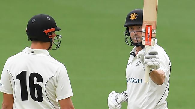 Shaun Marsh of Western Australia celebrates his half century during day one of the Marsh Sheffield Shield match between Queensland and Western Australia at the Gabba in Brisbane, Saturday, November 2, 2019. (AAP Image/Albert Perez) NO ARCHIVING, EDITORIAL USE ONLY