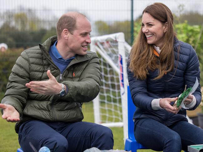 Britain's Prince William, Duke of Cambridge and Britain's Catherine, Duchess of Cambridge gesture during a visit to meet young people supported by the Cheesy Waffles Project. Picture: AFP