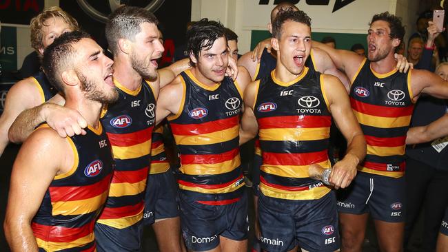 Lachlan Murphy, Bryce Gibbs, Darcy Fogarty and Tom Doedee celebrate their first victory in Crows colours against reigning premier Richmond on Friday night. Picture: SARAH REED