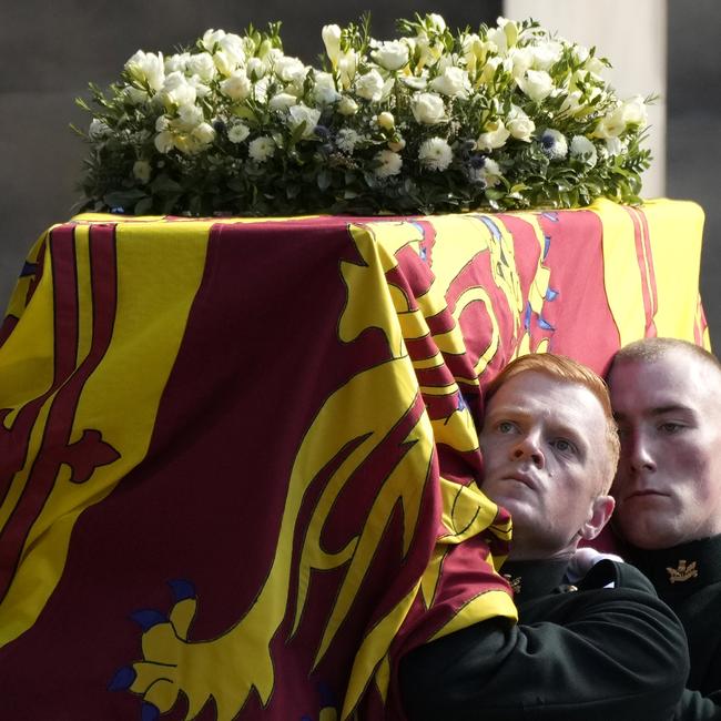 Royal guards carry Queen Elizabeth's coffin into St Giles Cathedral after its journey from Palace of Holyroodhouse in Edinburgh, Scotland.