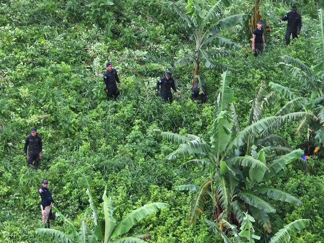 Soldiers and members of the Technical Criminal Investigation Agency (ATIC) destroy at least 30 hectares of Coca leaves at the mountains in Bonito Oriental, Honduras. Picture: Orlando Sierra