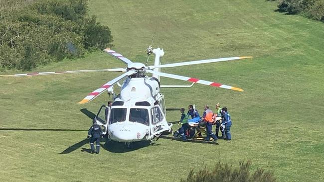 The young man being loaded into a chopper following a truck crash at Stanwell Park. Picture: Wendy Roche