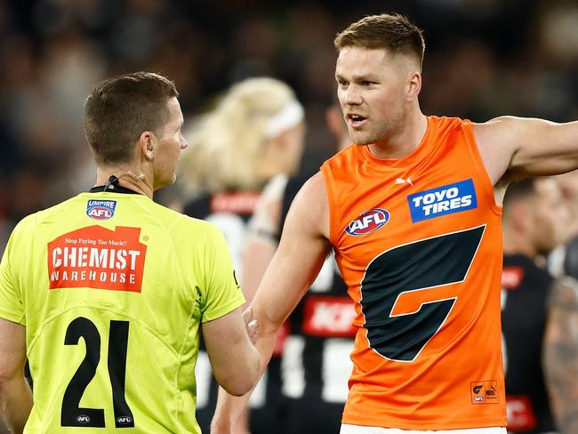 MELBOURNE, AUSTRALIA - SEPTEMBER 22: Harry Himmelberg of the Giants speaks with AFL Field Umpire, Simon Meredith during the 2023 AFL First Preliminary Final match between the Collingwood Magpies and the GWS GIANTS at Melbourne Cricket Ground on September 22, 2023 in Melbourne, Australia. (Photo by Michael Willson/AFL Photos via Getty Images)